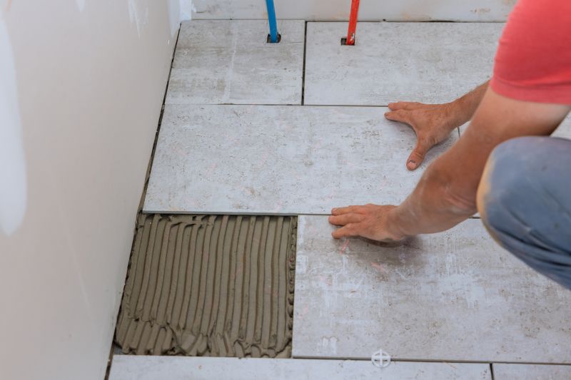 Professional Tile Installer at Work